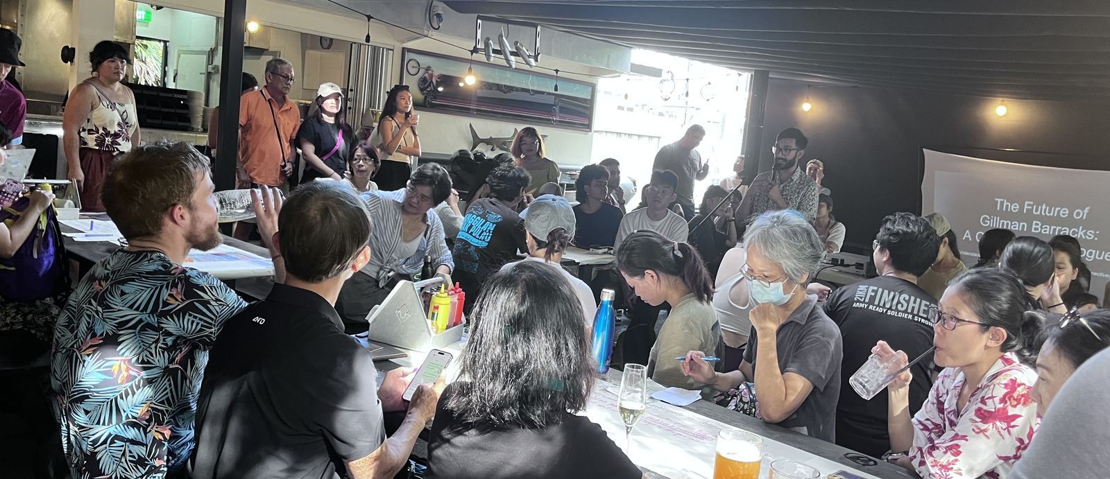 Residents seated around tables at the Gillman Barracks and Forest community forum