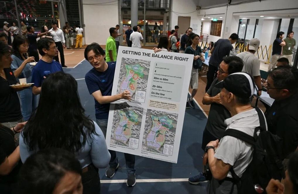 A resident presenting a poster titled Getting the Balance Right at the 30 July feedback session